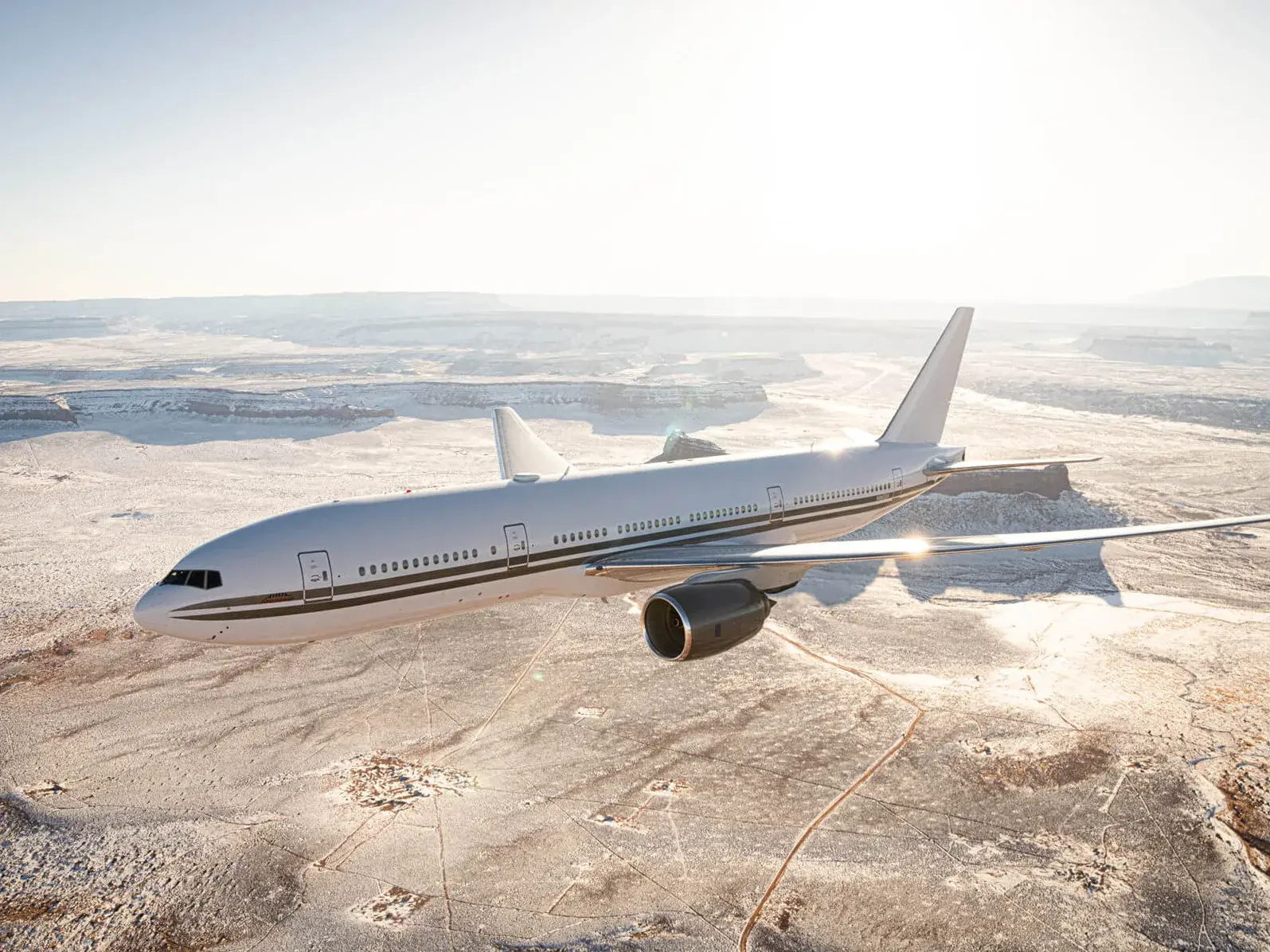 Boeing 777-200ER flying over a field